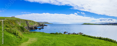 Scotland Shetland scenery in England with cliffs, ocean views and green pastures. photo