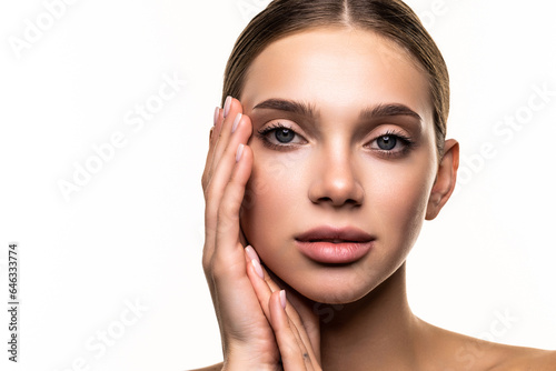 Beautiful young woman with clean perfect skin. Portrait of beauty model with natural nude make up.