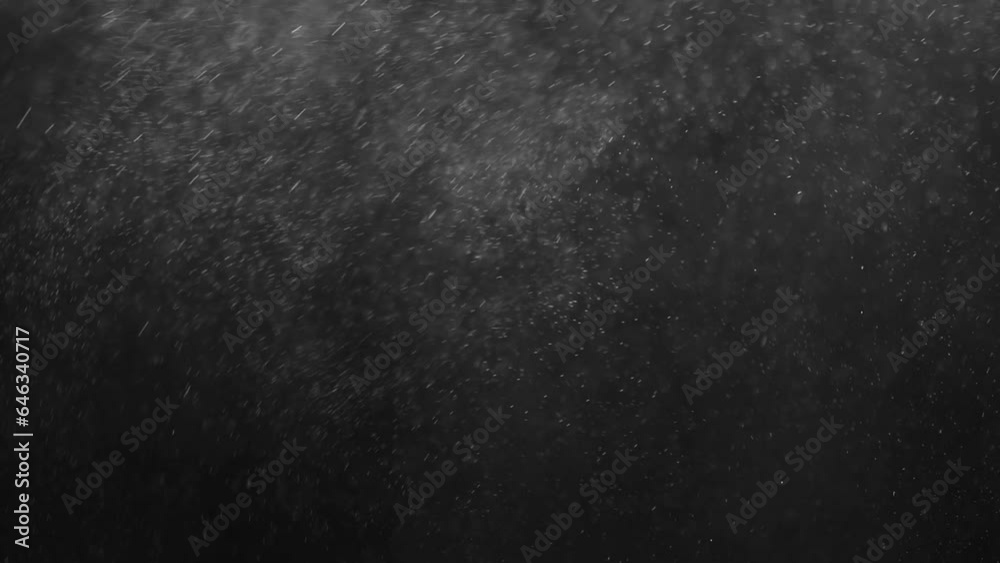 small drops of rain, snow on a black background. wind. Natural background. slow motion small drops of rain, snow on a black background. wind. Natural background. slow motion