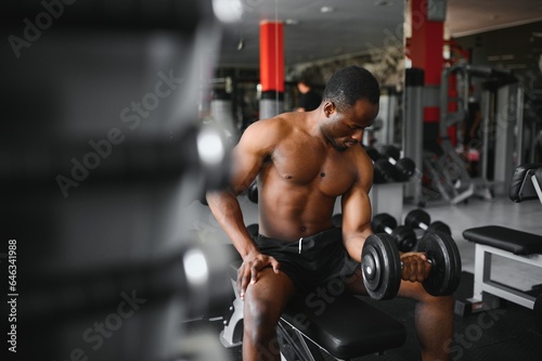 Young athletic African American man in the gym