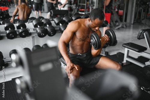 Young athletic African American man in the gym