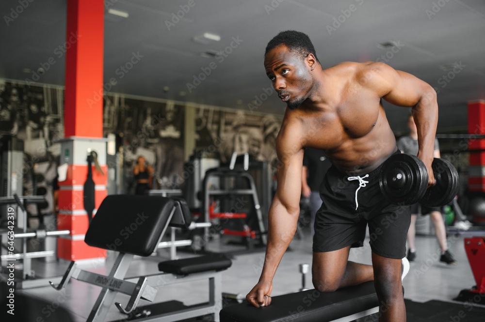 Young athletic African American man in the gym