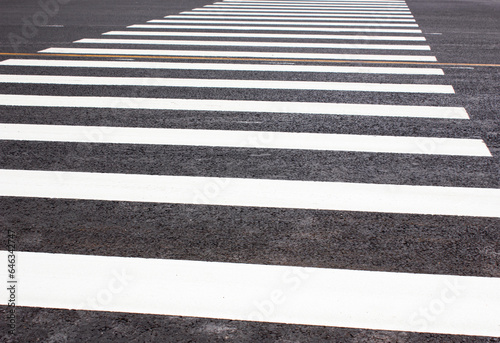 Crosswalk. Asphalt road with a crossing for pedestrians. Markings on the road for pedestrians.