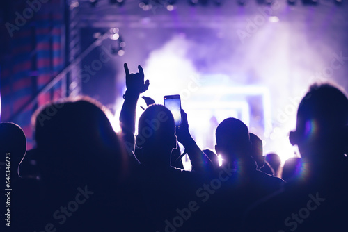 Abstract photo of crowd at concert and blurred stage lights.