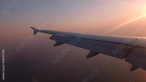 4k video of the sun setting behind an aircraft wing on approach to Luga International Airport in Malta photo