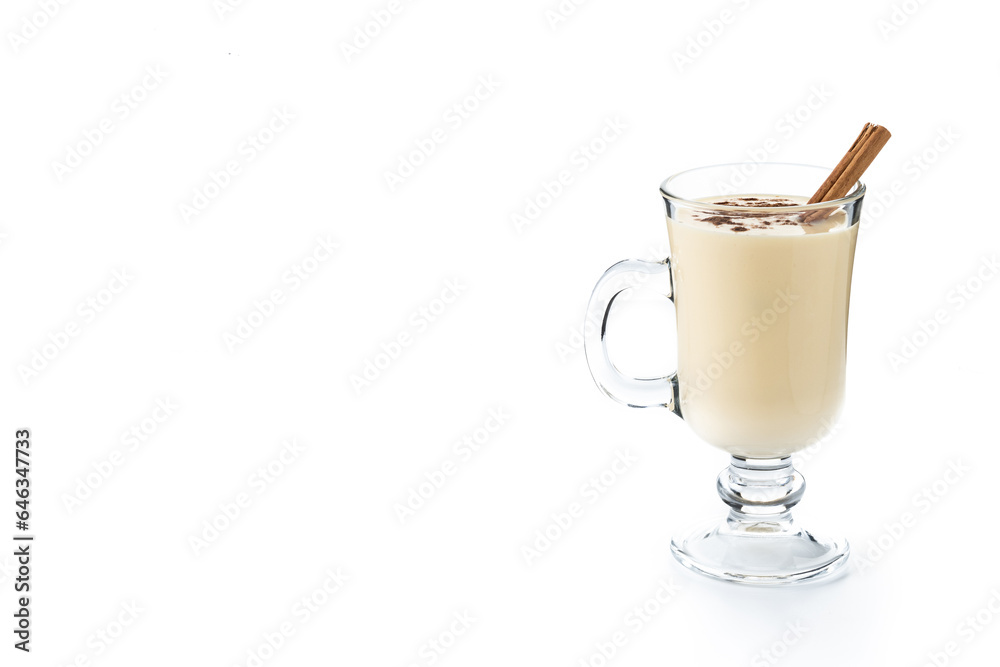 Homemade eggnog with cinnamon. Typical Christmas dessert isolated on white background. Copy space Homemade eggnog with cinnamon. Typical Christmas dessert isolated on white background. Copy space