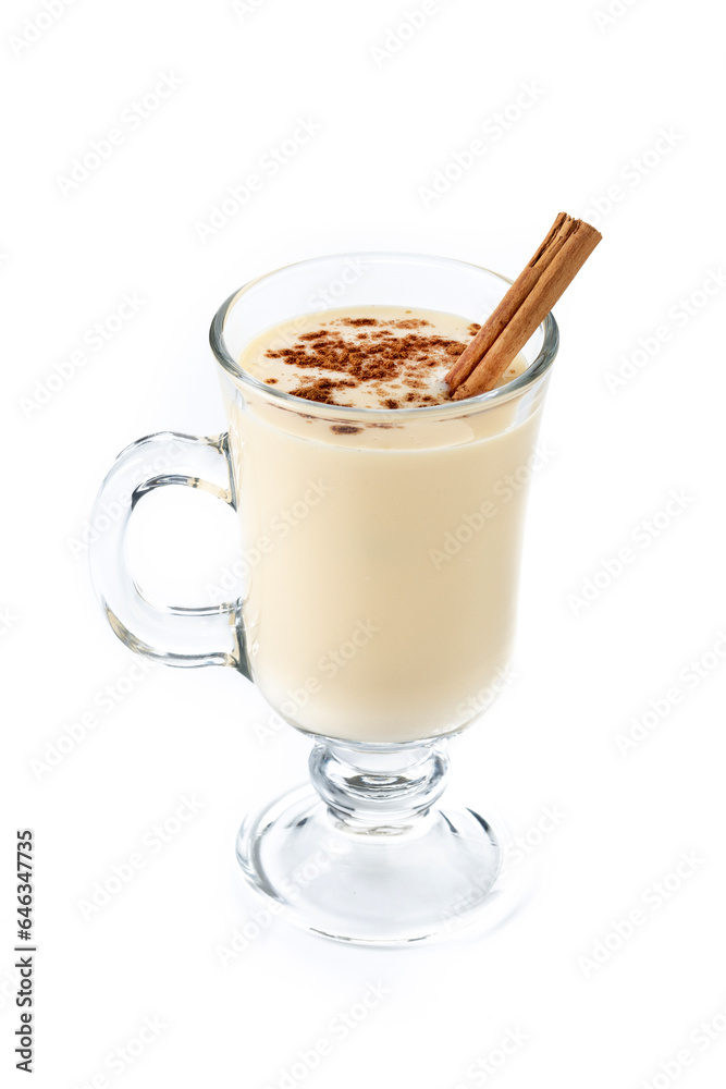Homemade eggnog with cinnamon. Typical Christmas dessert isolated on white background Homemade eggnog with cinnamon. Typical Christmas dessert isolated on white background