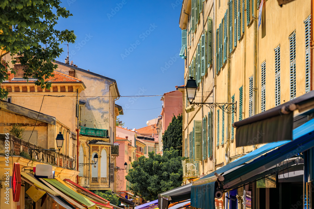 Picturesque colorful traditional houses near the local farmers market in the Old Town, Vieille Ville in Menton, French Riviera, South of France