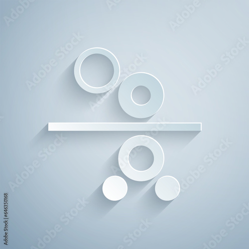 Paper cut Paper roll of a printing press icon isolated on grey background. Paper art style. Vector