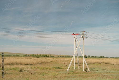 Minimalistic landscape with power poles.