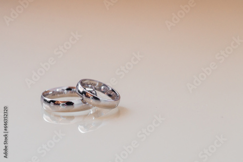 pair wedding rings a in ring on white background, top view flat lay