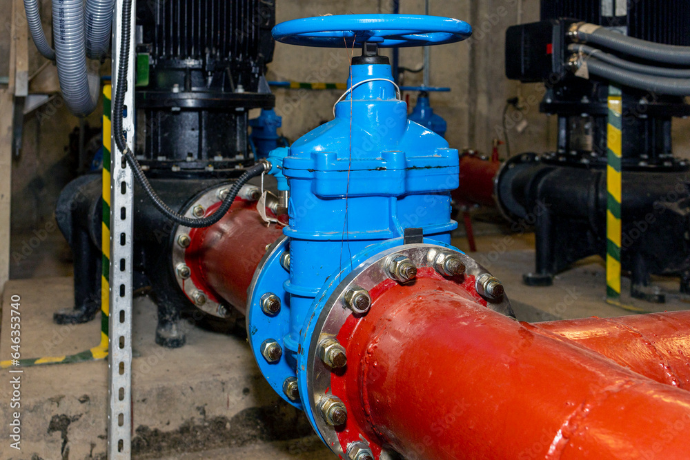 Industrial electric water pumps, pipes and valves - industry concept. Industrial electric water pumps, pipes and valves - industry concept.
