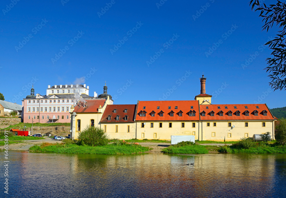 The Sazava River and the town of Kacov with a brewery and a baroque castle on the river bank. Bohemia, Czech Republic