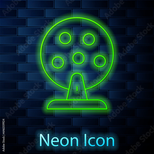 Glowing neon line Lottery machine with lottery balls inside icon isolated on brick wall background. Lotto bingo game of luck concept. Wheel drum leisure. Vector
