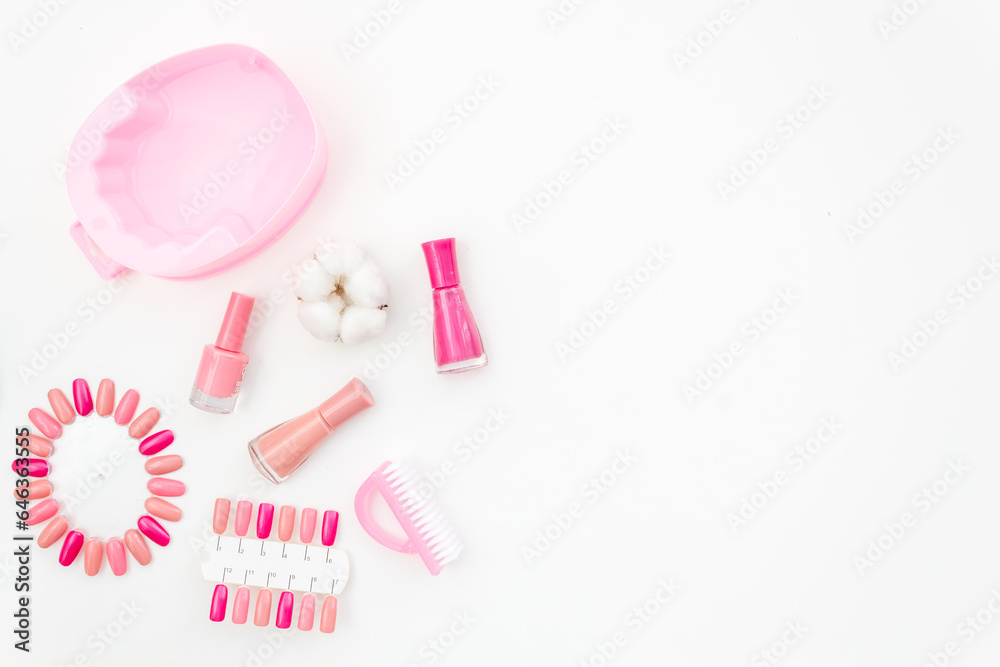 Obraz premium Pink and nude trend colors gel varnishes with manicure and pedicure beauty tools