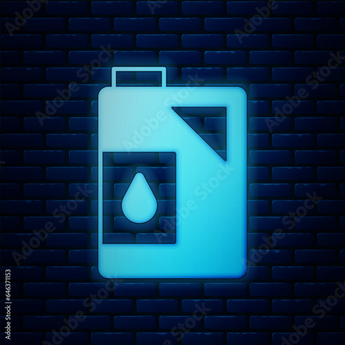 Glowing neon Canister for motor machine oil icon isolated on brick wall background. Oil gallon. Oil change service and repair. Engine oil sign. Vector