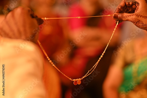 Holding Golden Mangalsutra. Married Woman Golden Chain. Indian Wedding Necklace. Maharashtra Cultture. Maharashtra Wedding Elements. 