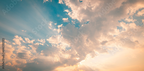 Morning sky bright golden yellow cloudy panoramic positive energy background. Inspire sunrise wide angle skyscape sun rays. Beautiful sunset skyline nature meditation motivation. Peaceful heaven dream © icemanphotos