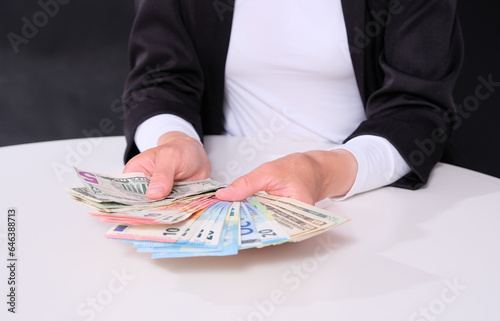 Businesswoman holds money