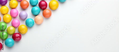 Colorful gummy balls on isolated pastel background Copy space