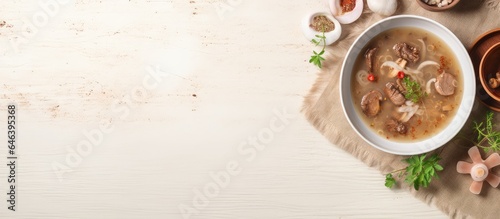 Chinese white bowl soup with braised pork bamboo and herbs isolated pastel background Copy space
