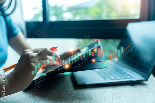 Businessman pointing finger to growth success finance business chart and analy sales data, Stock market, Strategy and planning