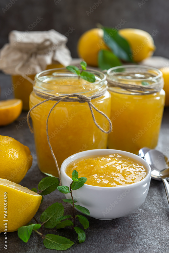 Freshly made homemade lemon jam in glass jars. Freshly made homemade lemon jam in glass jars.