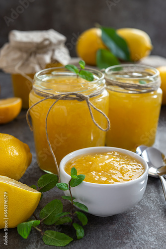 Freshly made homemade lemon jam in glass jars.