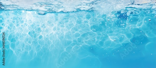 Background with space for text featuring blue water air bubbles and a black pool isolated pastel background Copy space