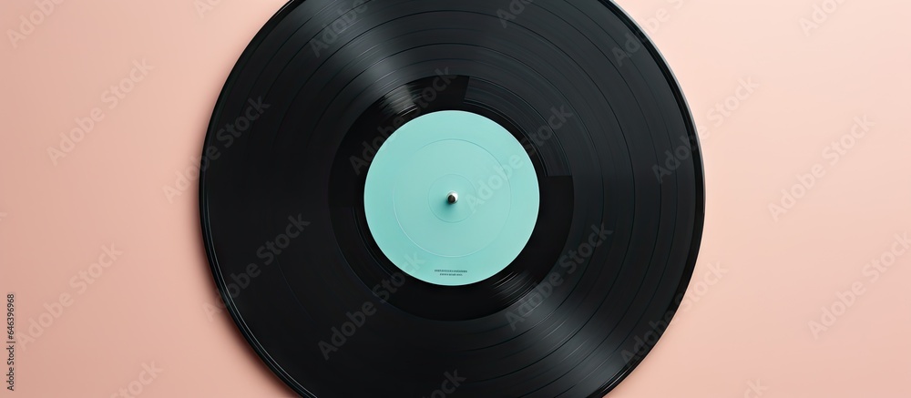 Black vinyl record on a isolated pastel background Copy space Black vinyl record on a isolated pastel background Copy space