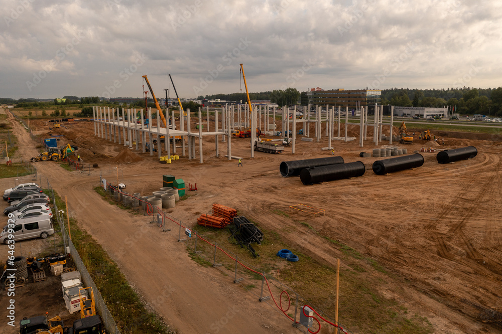 Drone photography of a large construction site with lots of machinery Drone photography of a large construction site with lots of machinery