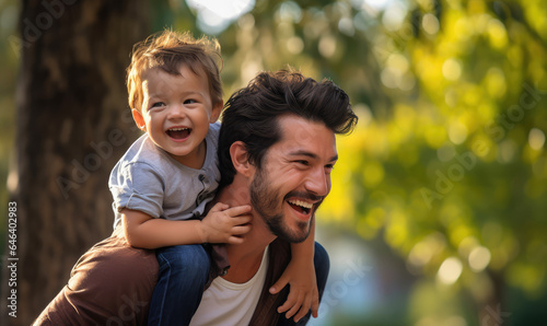 Father playing with son in an outdoor park during Children's Day celebrations.