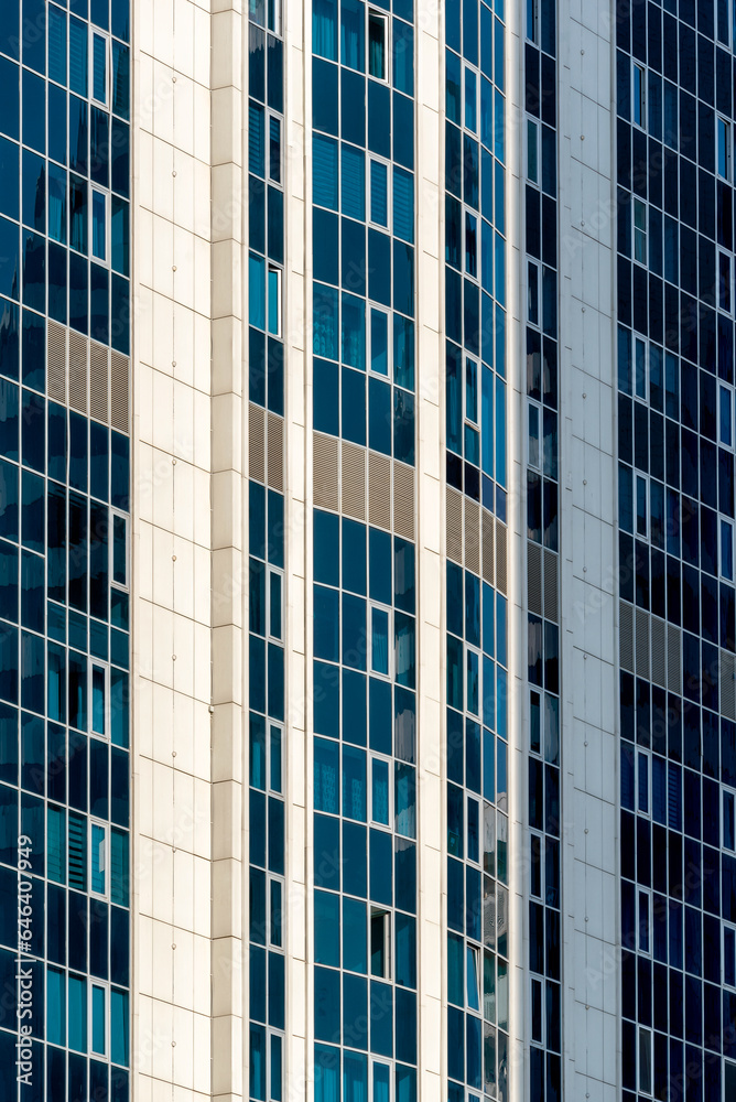 many windows and walls facade of a modern skyscraper without people many windows and walls facade of a modern skyscraper without people