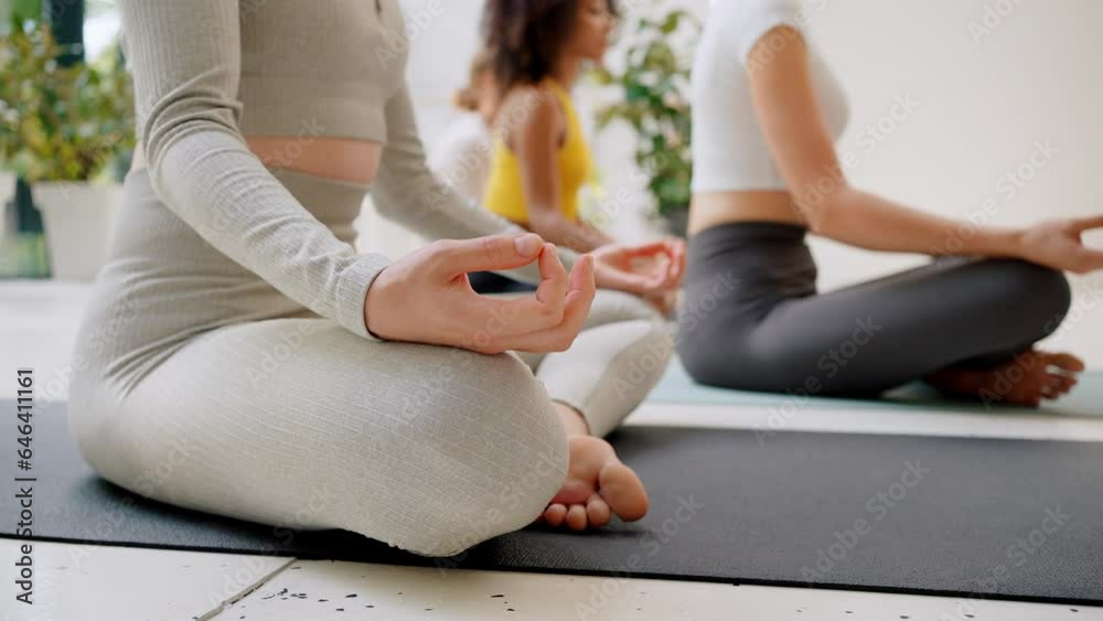 Woman sitting in lotus pose on regulary meditation training Woman sitting in lotus pose on regulary meditation training