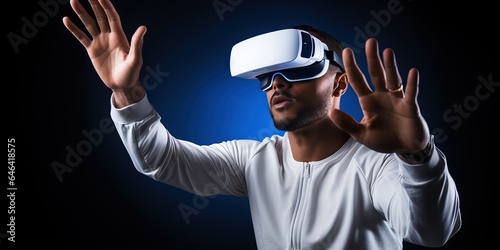 man shows his hand on the vr gadget over a dark background