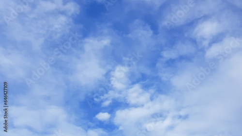 Picture of a blue sky with thin white clouds.