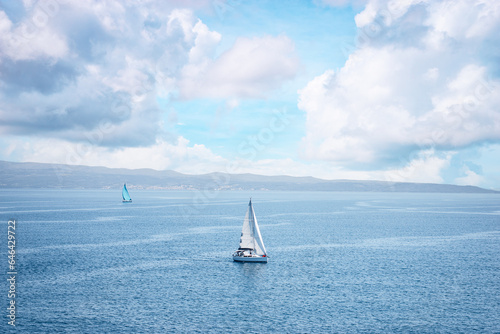 Seascape with white yacht sailing the sea