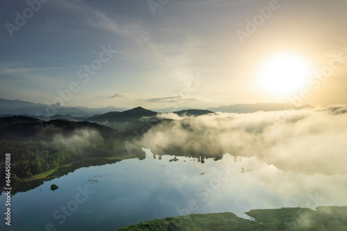 Misty morning mountain view, Kerala aerial drone landscape image, awesome sunrise view of Edakkanam Lake © sarath