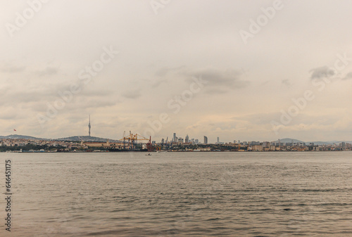 View of bosphorus strait water at mid day with light and bridge with skyline © Radu