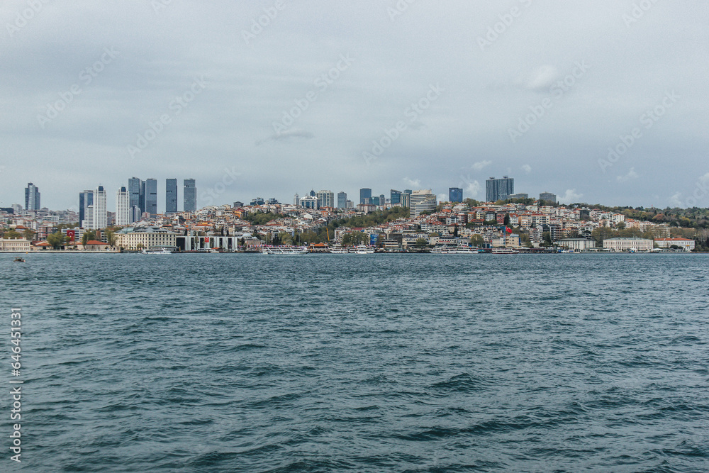 View of bosphorus strait water at mid day with beautiful light and bridge with skyline