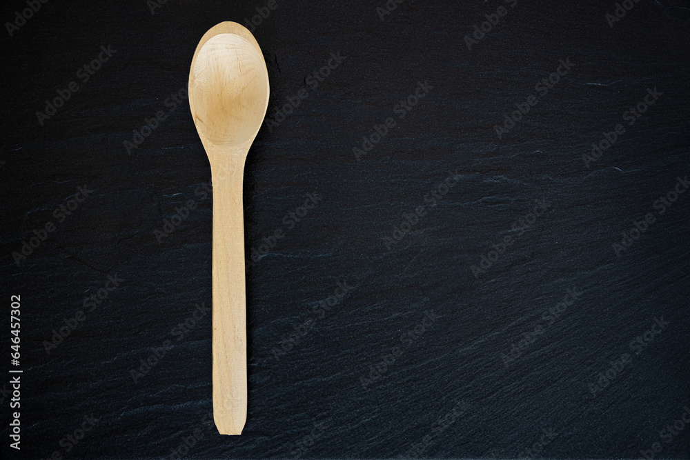 Wooden Spoon on black background Wooden Spoon on black background