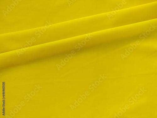 The golden yellow silk texture background has beautiful patterns.