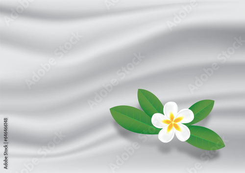 Tropical flower on wrinkles white fabric