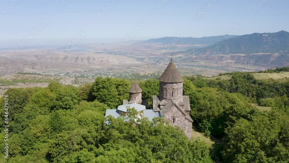 Forward reveal aerial shot of Makaravank Monastery on sunny summer day. Achajur, Armenia. Forward reveal aerial shot of Makaravank Monastery on sunny summer day. Achajur, Armenia.