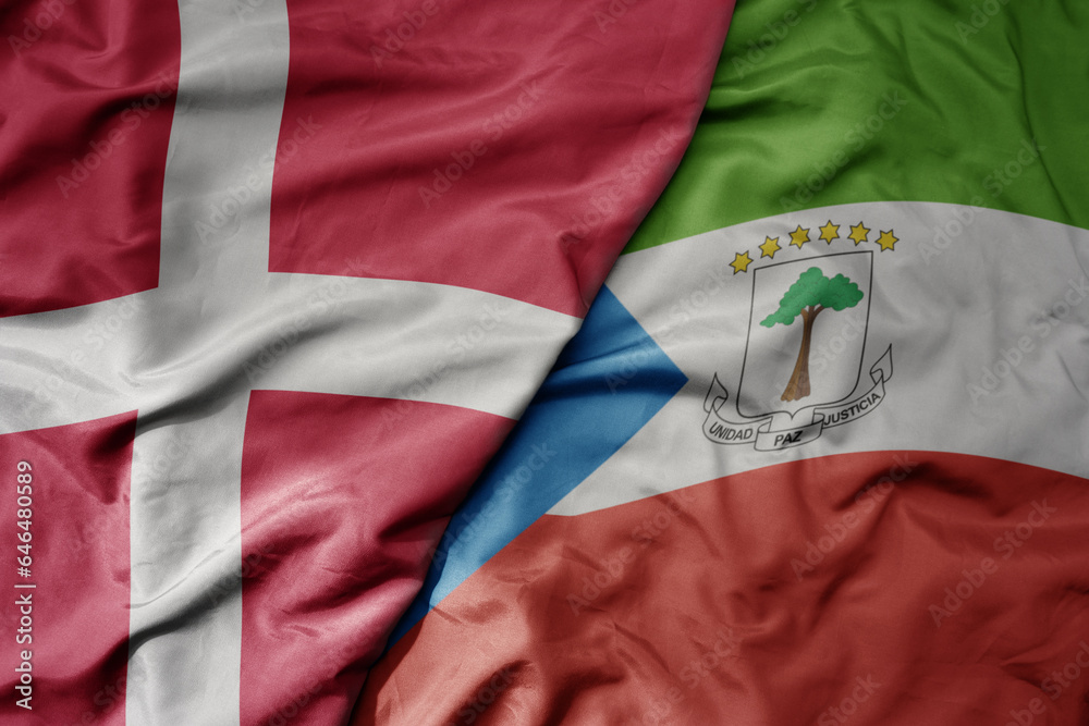 Fototapeta premium big waving national colorful flag of denmark and national flag of equatorial guinea .