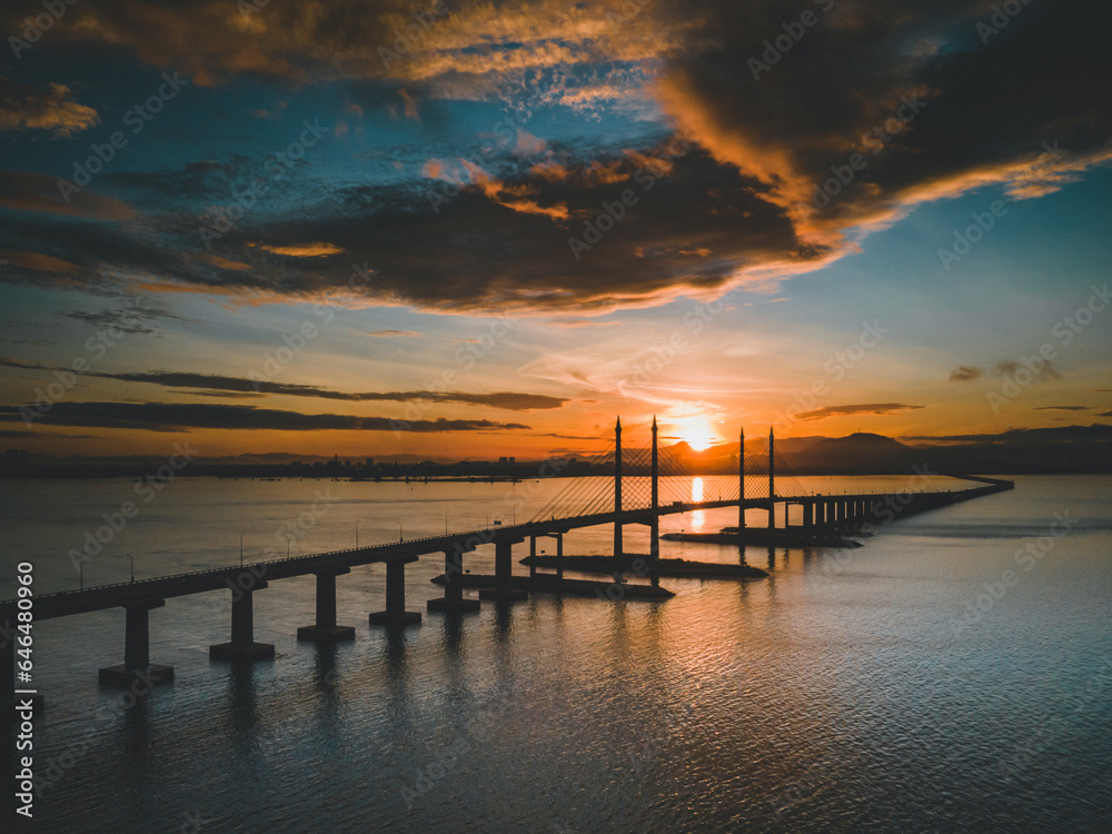 Morning sunrise with cloudy sky at Penang Bridge, Penang Island, Malaysia.