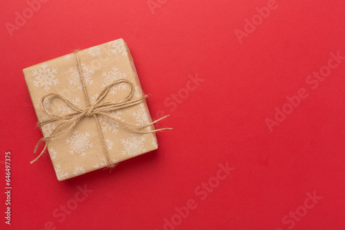 Craft christmas gift boxes on color background, top view © Liami