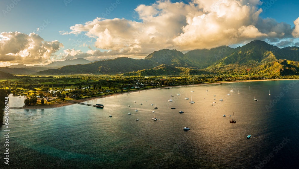Aerial view of the bay and town of Hanalei with famous pier as the sun rises over the wildlife refuge