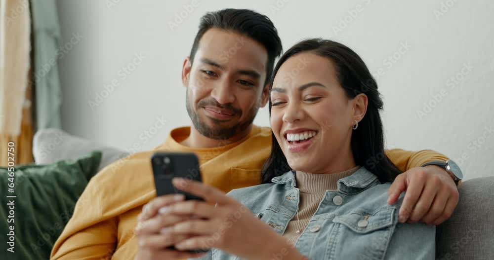 Couple, smile and talking on sofa with phone for social media post, subscription and reading funny notification. Happy man, woman and hug with smartphone for meme, games app and relax in living room