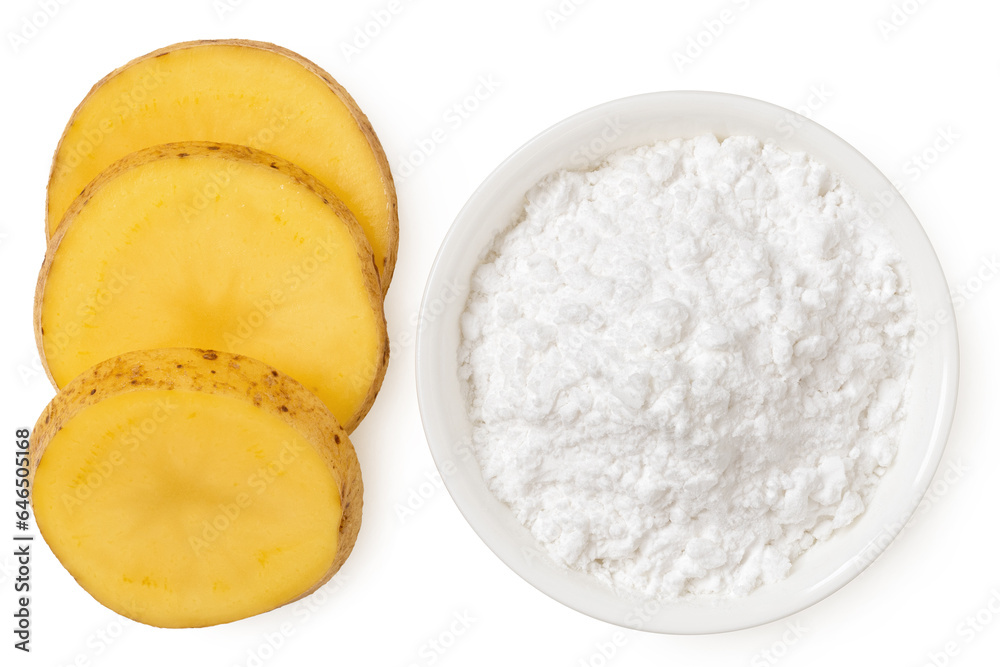 Potato starch in a white ceramic bowl next to slices of raw potato with skin isolated on white from above.